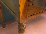 a wooden table with a drawer on top of it