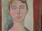 portrait of a woman in a blue dress by a red wall