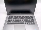 an open laptop computer sitting on top of a white table