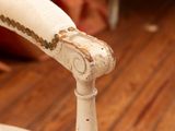 a close up of a chair on a wooden floor