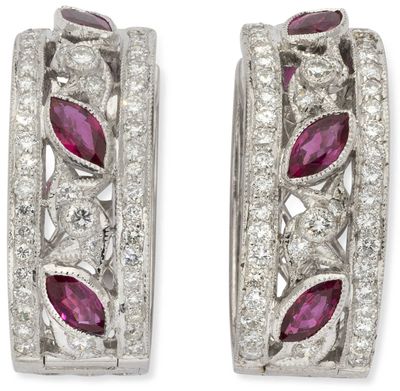 a pair of ruby and diamond hoop earrings