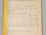 an old sheet of music with a yellow border on top of it