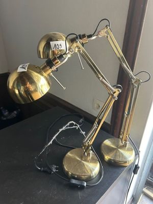 two lamps that are sitting on a black table