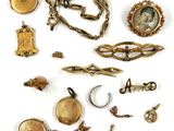 an image of a collection of antique jewelry on a white background