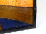 abstract painting of orange, blue, and yellow with a black frame