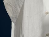 a close up of a white shirt on a mannequin mannequin mannequin mannequin mannequin mannequin mannequin