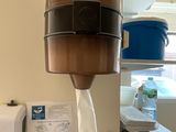 a paper towel dispenser hanging from the ceiling