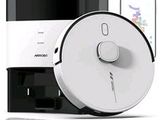 an image of a white and black vacuum cleaner next to a smart phone