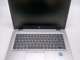 an open laptop computer sitting on top of a white table