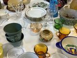 a table with a lot of dishes and cups on it