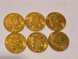 six gold sovereigns of the british empire