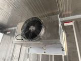 a fan that is hanging from the ceiling of a building