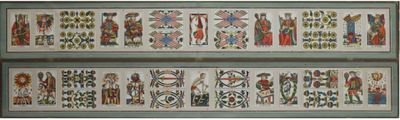 two cross stitchs of different colors and designs on a wall