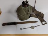 a knife, a bottle opener, and a pair of scissors on a table