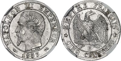 a silver coin with an eagle on the front and a head on the back