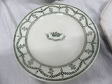 a plate with a crown on it sitting on a table
