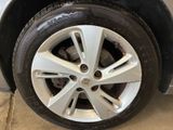 the tire of a car with a flat tire on the ground