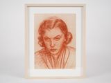 a drawing of a woman ' s face in a wooden frame