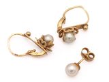 two pairs of pearl and gold earrings on a white background