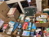 many boxes of books and other items in a room