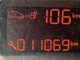 a close up of a digital clock on the dashboard of a car
