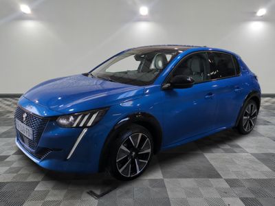 a blue car parked on a checkered floor in a garage