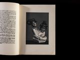 an open book with a black and white photo of a naked man