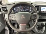 the interior of a car with a steering wheel and dashboard controls