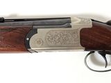 a close up of a rifle on a white surface with a white background
