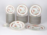 many plates and cups that are stacked on top of each other