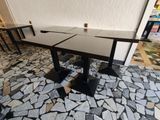two tables that are set up on the floor