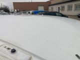 a close up of the hood of a white car