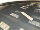 a parking ticket on the hood of a car