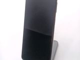 a cell phone that is sitting on top of a stand