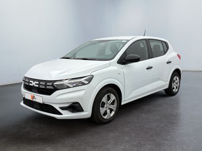 a white car is parked in a room with a black floor