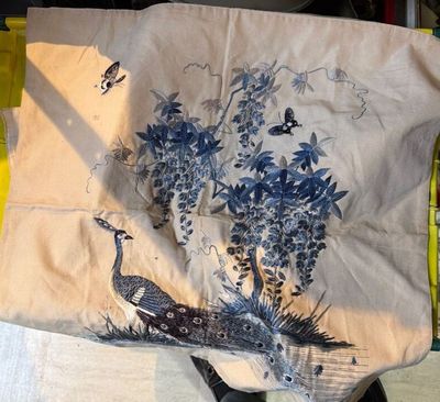 a bag that has a picture of a peacock on it
