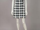 a mannequin dress with a black and white checkered pattern