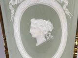 a vase that has a picture of a woman in it