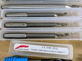 many different types of drill bits in a plastic case