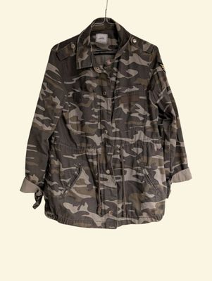 an image of a camouflage jacket hanging on a clothes hanger