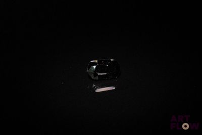 an image of a black diamond on a black surface