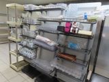 many shelves with food items on them in the kitchen