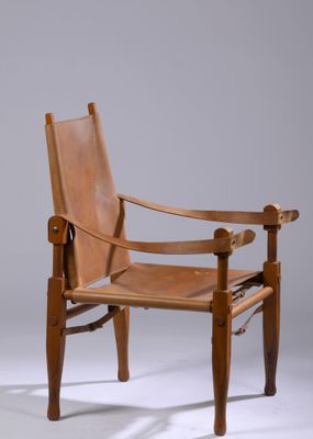 an image of a wooden chair with a brown leather seat