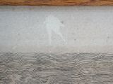 a close up of a piece of wood on the floor