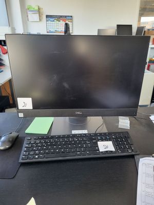an image of a desk with a computer monitor and keyboard