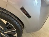 a close up of a car with a sticker on the side of it
