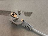 a cord that is connected to an electrical outlet