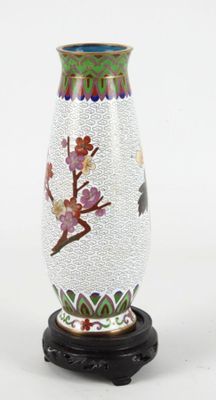 a glass vase with a floral design on it