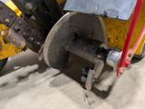a close up of a machine that is working on concrete