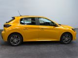 a yellow car is parked in a room with a white wall